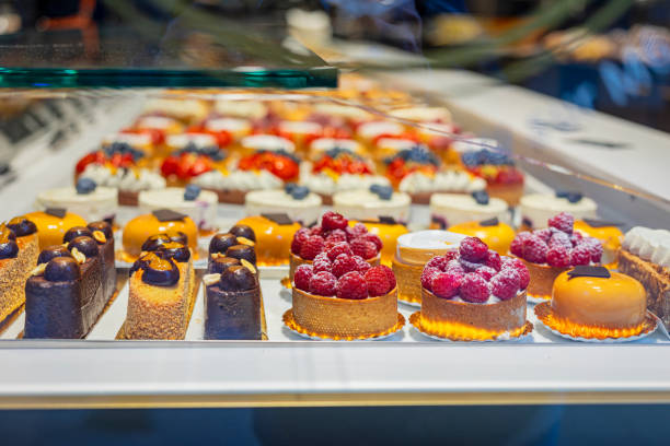 Assorted colorful pastries with raspberries and chocolate